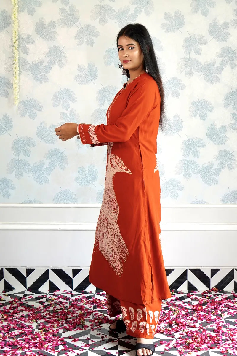 RUST ORANGE KURTA SET WITH HAND-PRINTED WHITE PEACOCK MOTIF & CONTRAST DETAILING