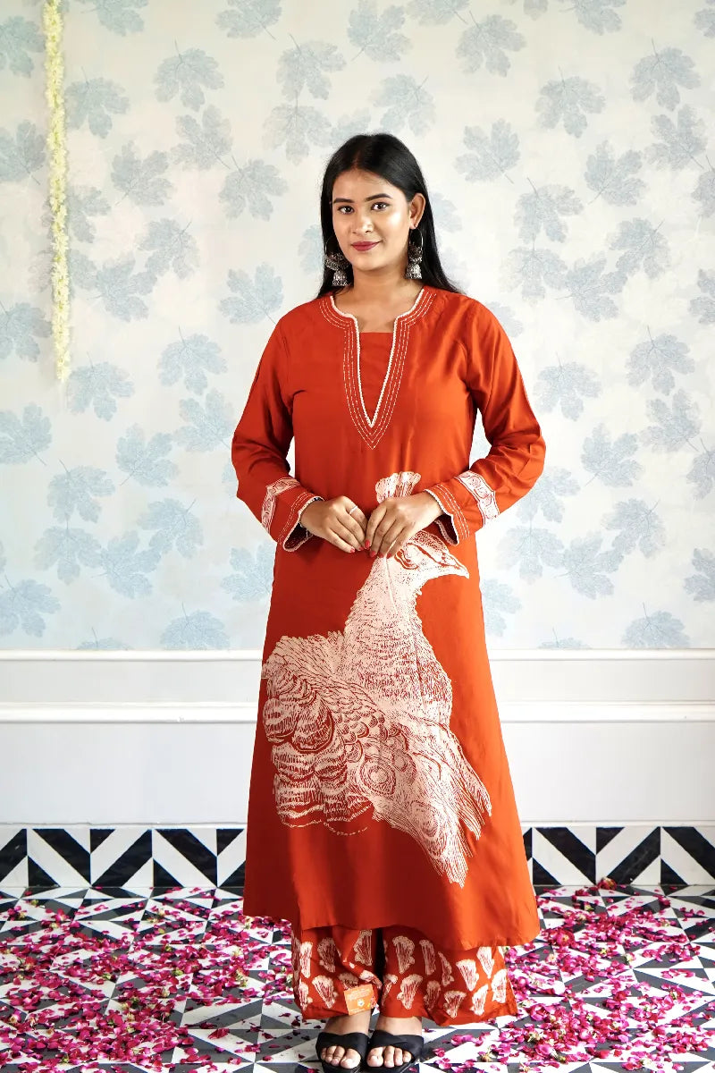 RUST ORANGE KURTA SET WITH HAND-PRINTED WHITE PEACOCK MOTIF & CONTRAST DETAILING