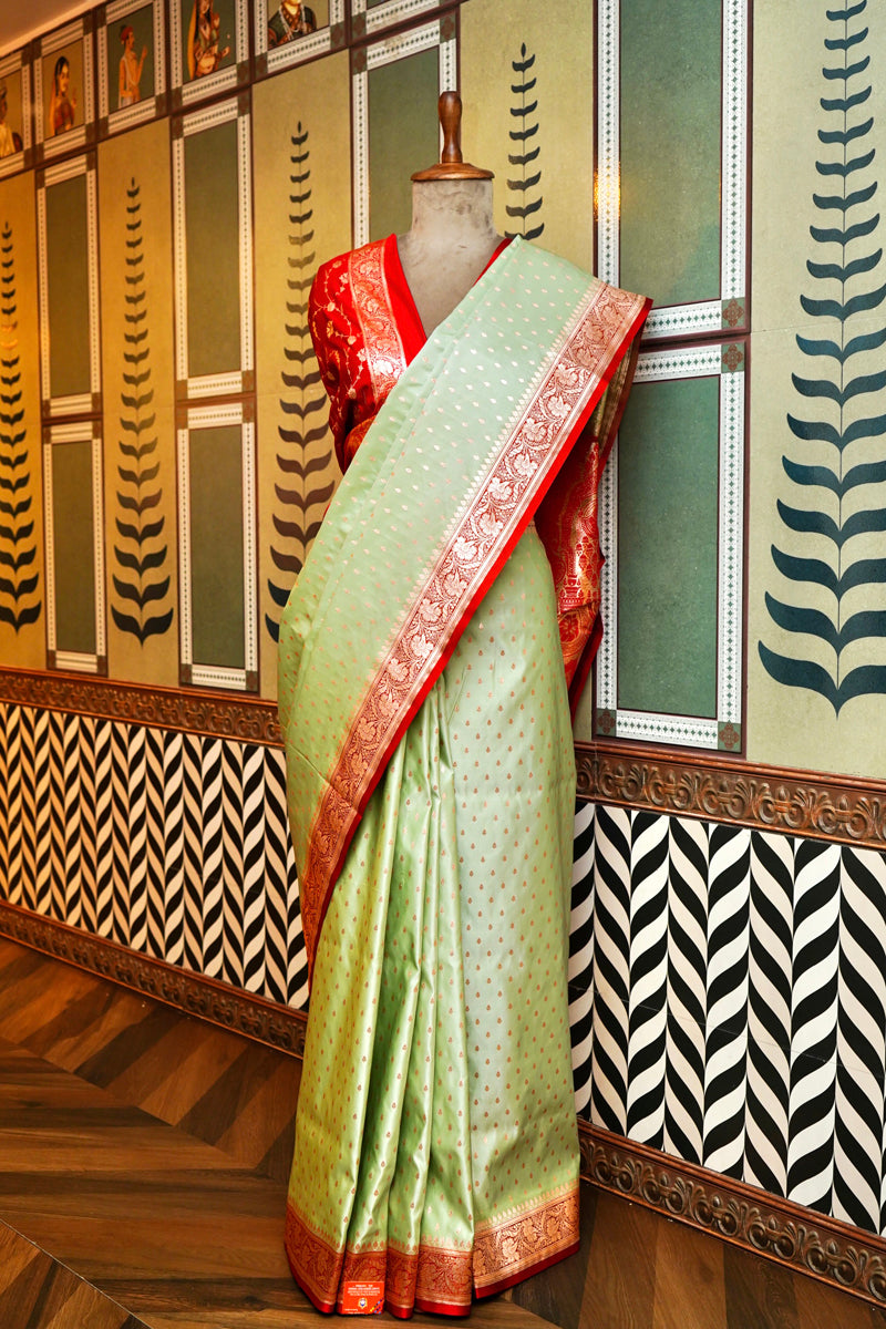 PESTLE PISTA GREEN SILK SAREE WITH RED BORDER