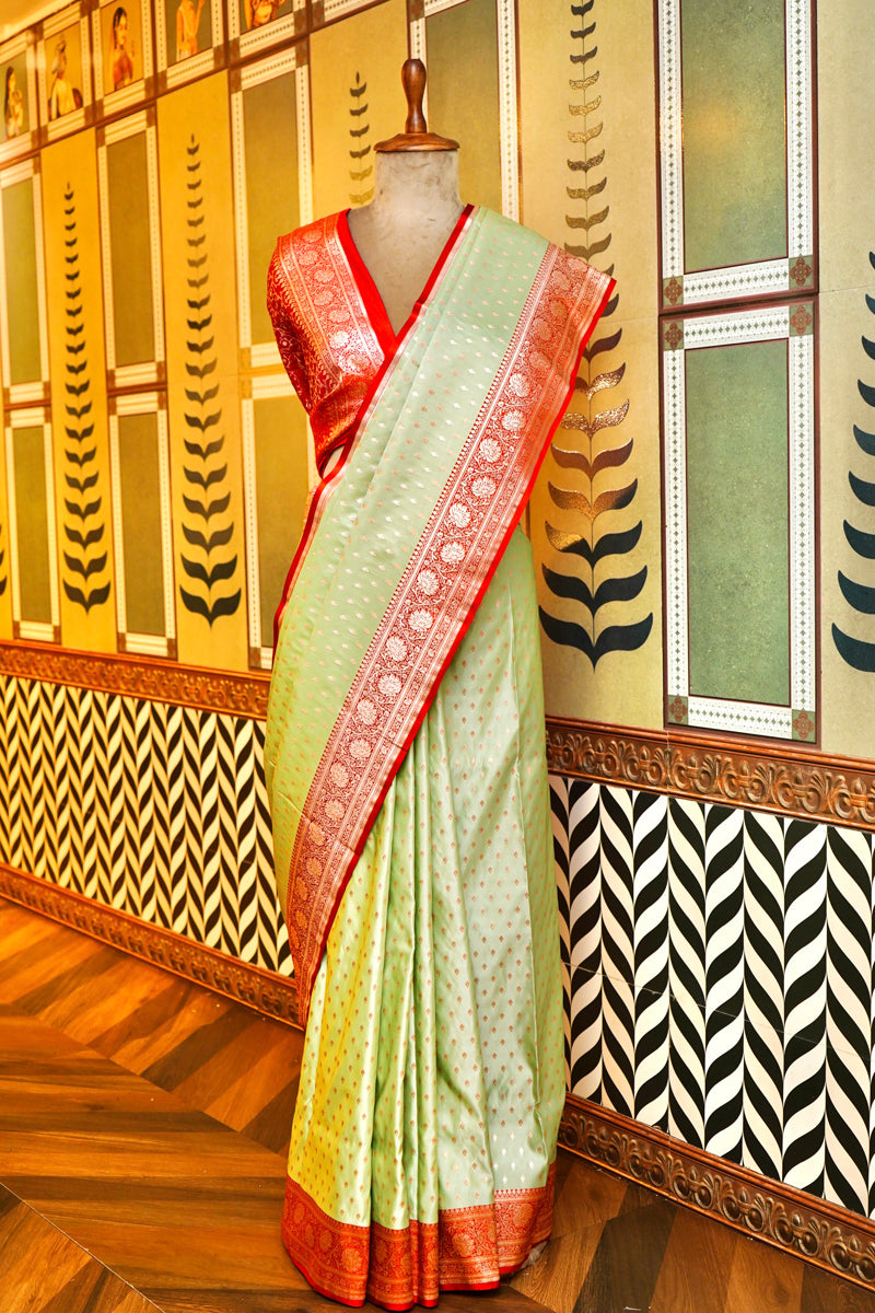 PESTLE PISTA GREEN WITH GOLDEN ZARI BOOTI WORK WITH RED BORDER