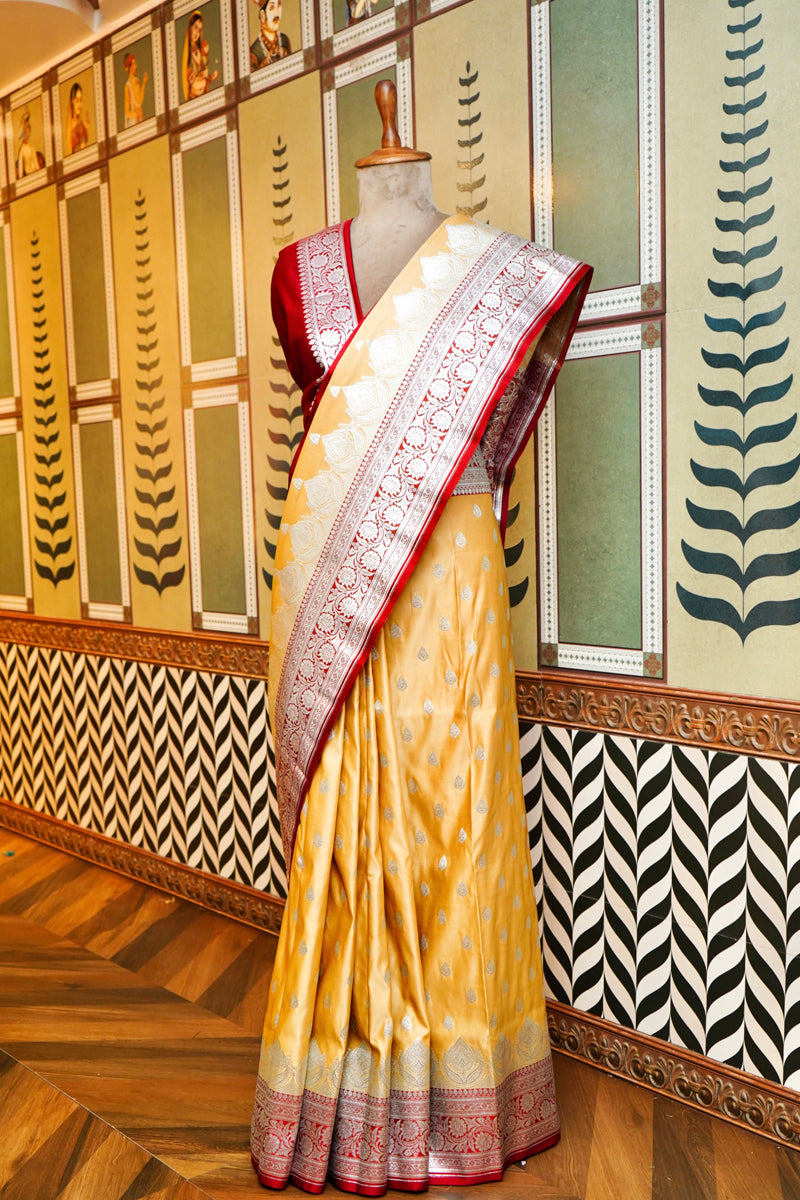 PESTLE YELLOW BANARASI SILK SAREE WITH RED BORDER