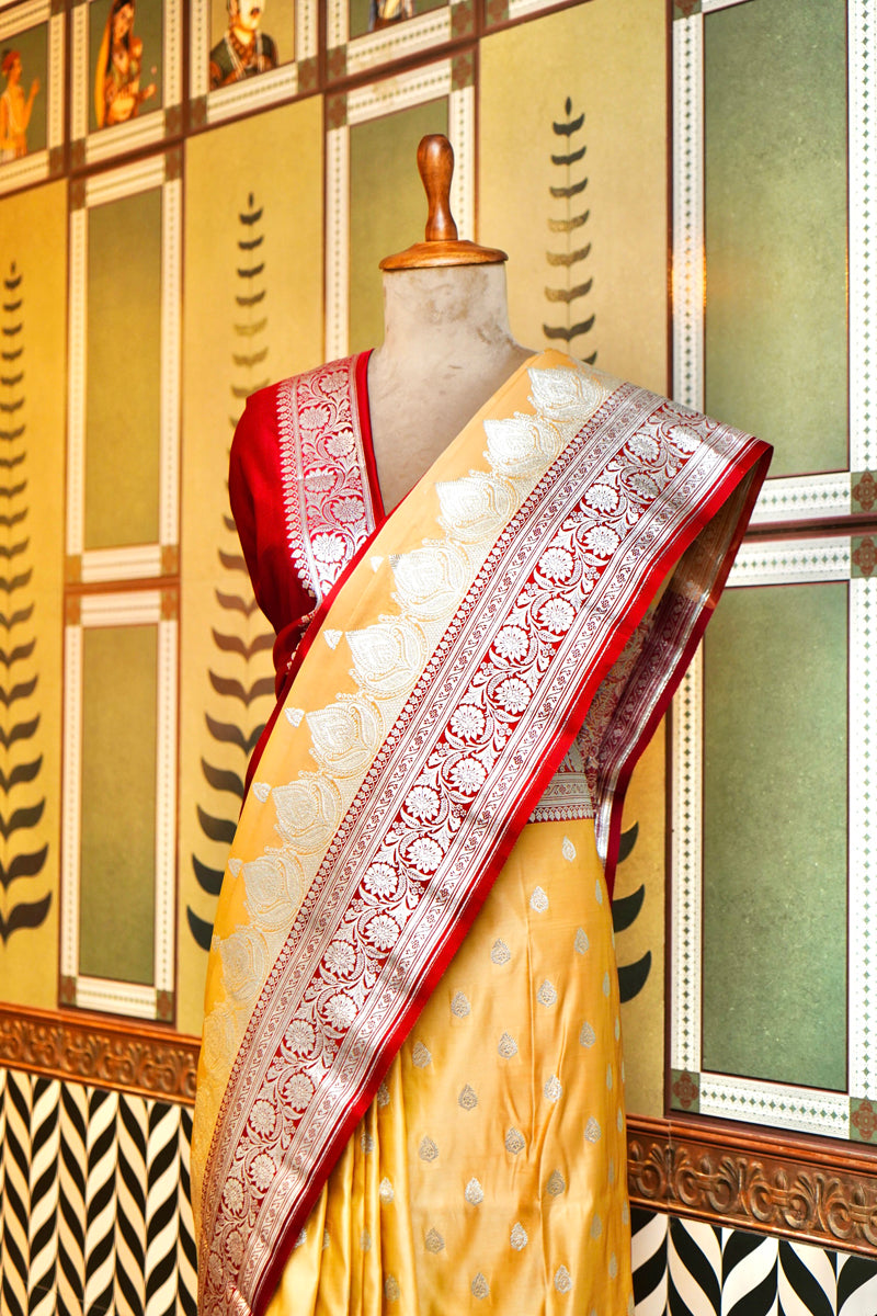 PESTLE YELLOW BANARASI SILK SAREE WITH RED BORDER